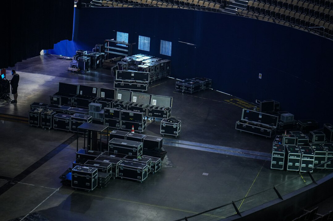 Production control room desks with multiple screens showing a live show rundown
