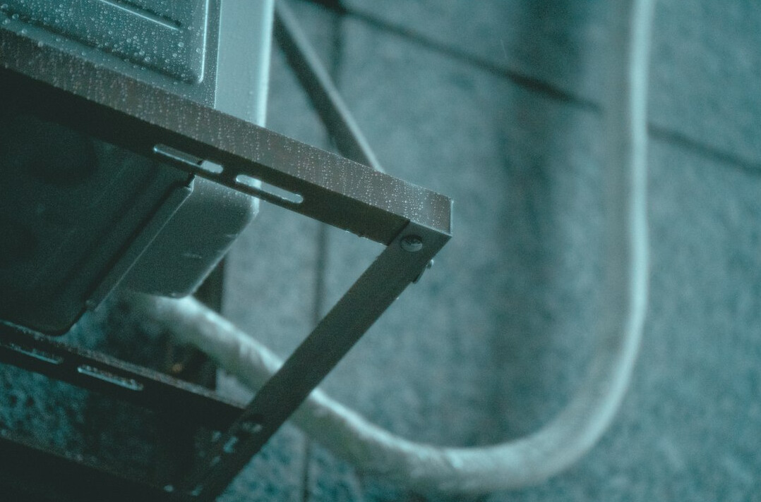 Studio equipment racks with neatly routed cables and monitors