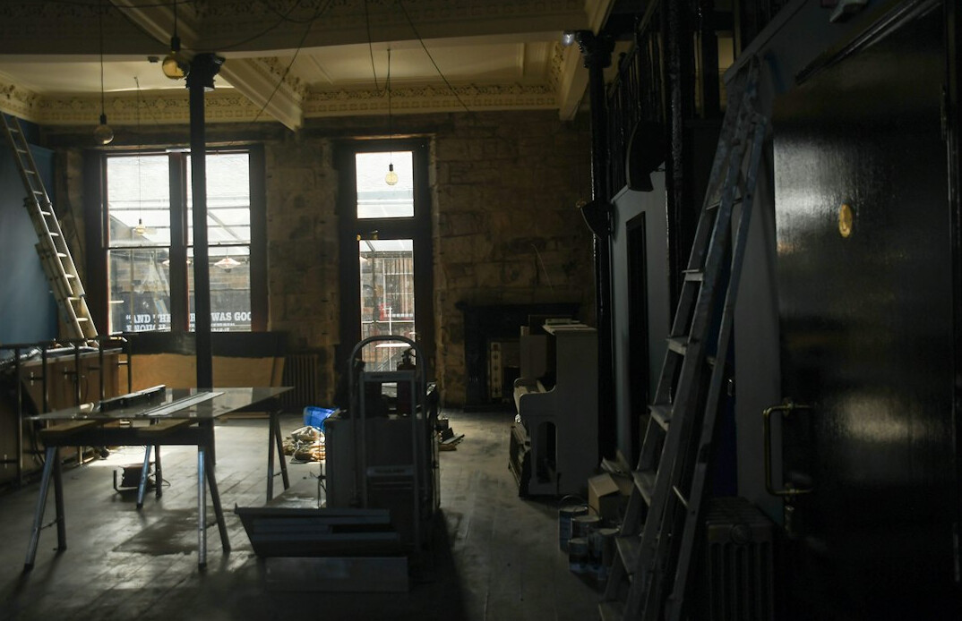 Training room with rows of monitors and camera equipment ready for a workshop